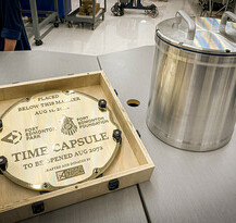 Image of the plaque and the time capsule side by side.