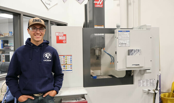 Adam, one of the school's machinist program students.