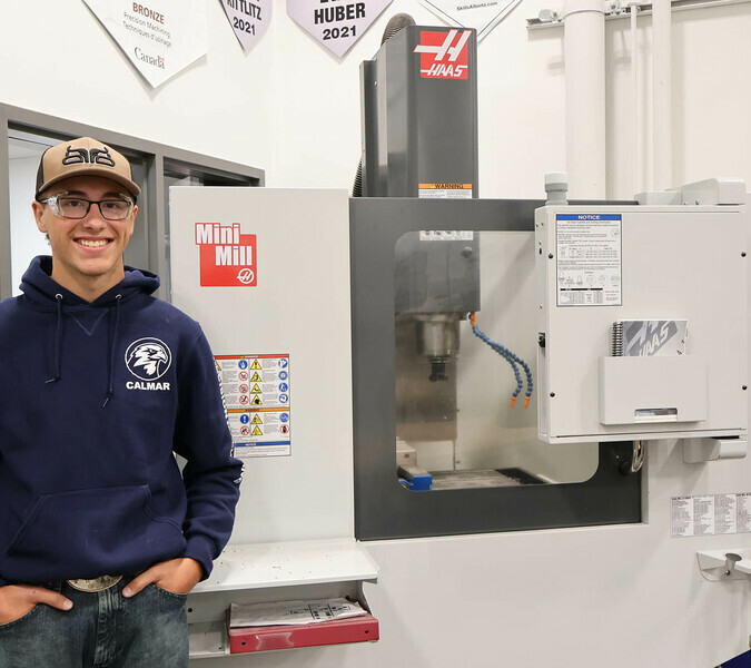 Adam, one of the school's machinist program students.